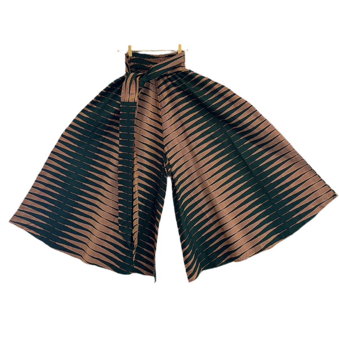 Striped pants with brown and green pattern on a white background